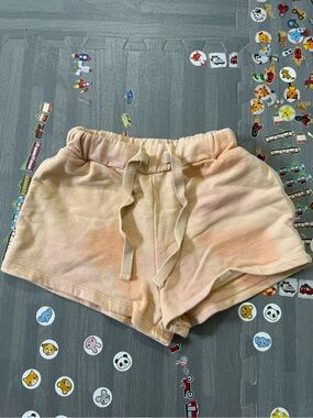 The new society Orange tie-dye shorts